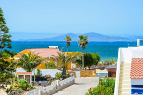 Bohemian Seafront Bungalow Paradise with BBQ, Garden, Terrace & Free Wifi by Holidays Home